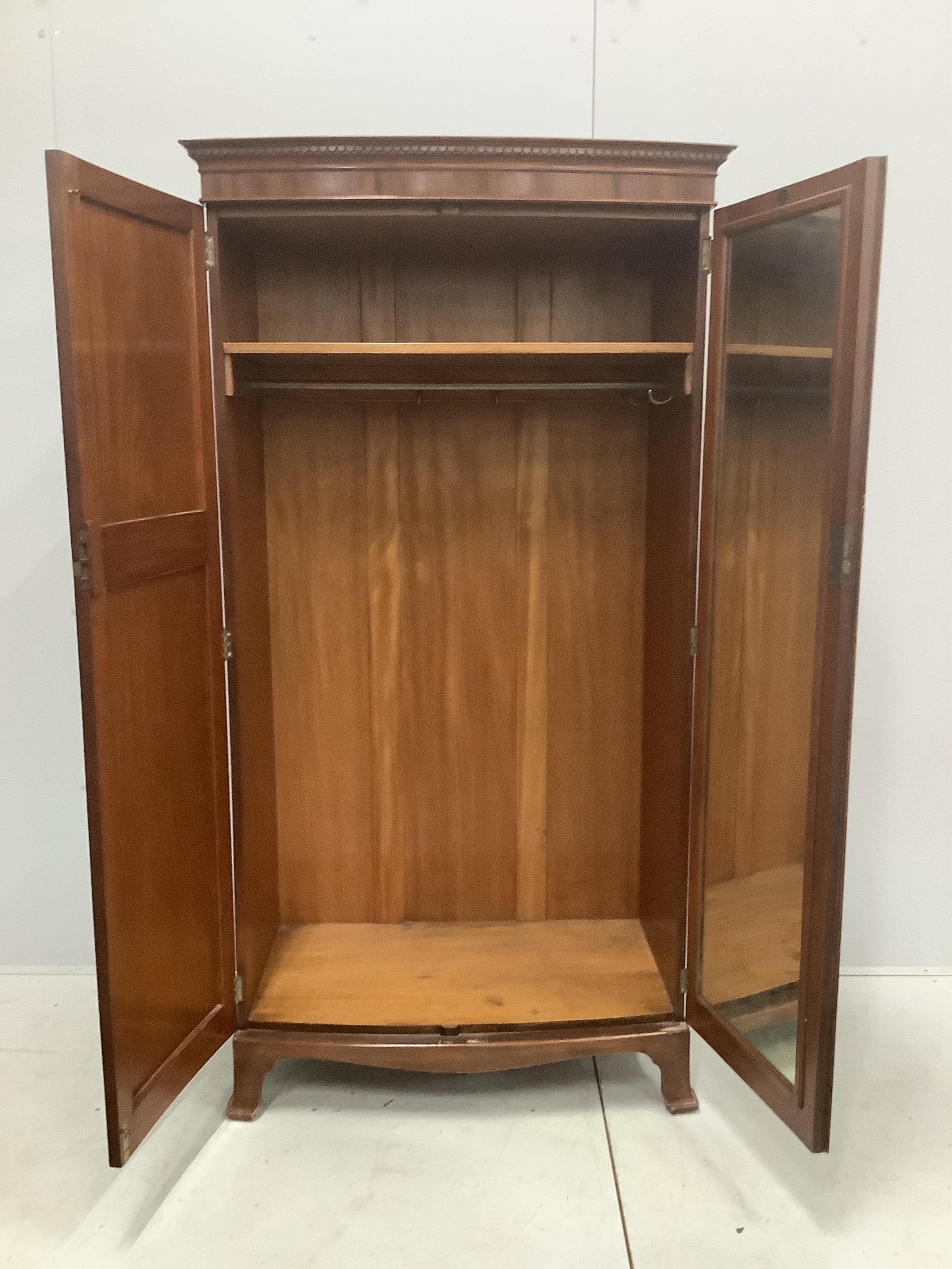 An Edwardian inlaid mahogany bowfront wardrobe, Maple & Co label, width 96cm, depth 53cm, height 182cm. Condition - good